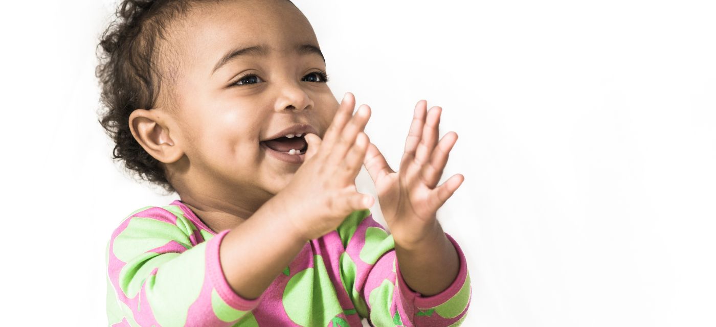 Toddler clapping hands.